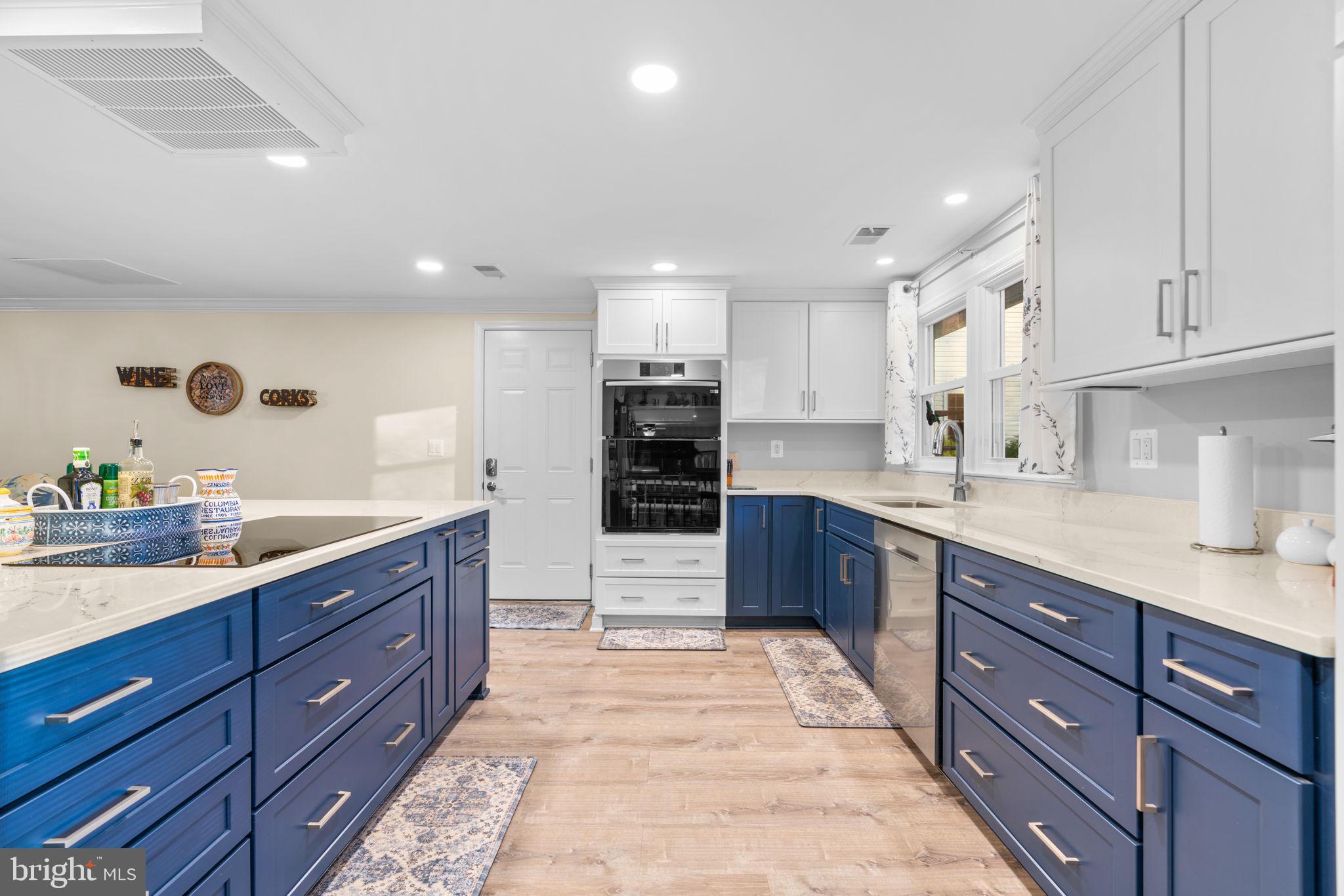 9413 Sunfall Court Columbia, MD 21046 - Photo 23 of 71 a large kitchen with stainless steel appliances granite countertop a large counter top a sink and cabinets