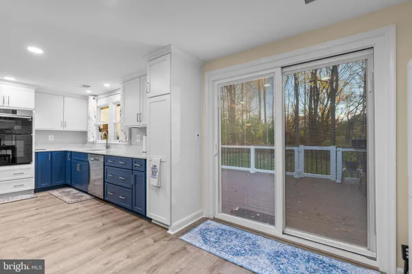 a bathroom with a bathtub and a window