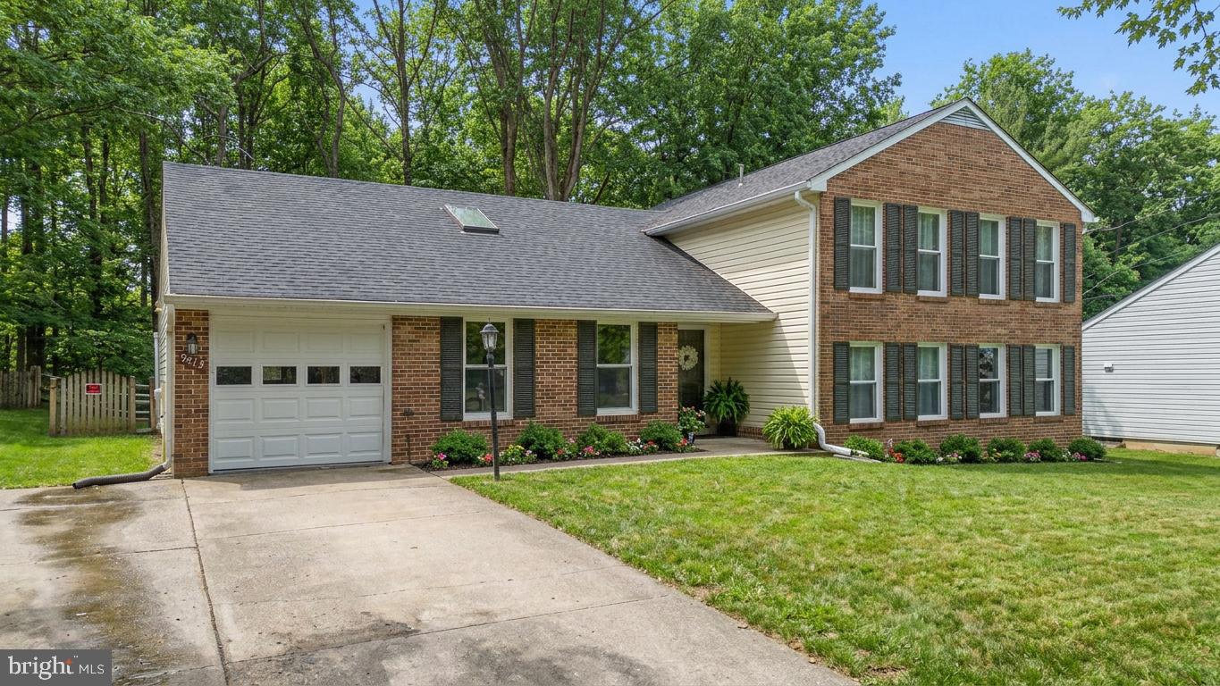 9413 Sunfall Court Columbia, MD 21046 - Photo 4 of 71 a front view of a house with garden