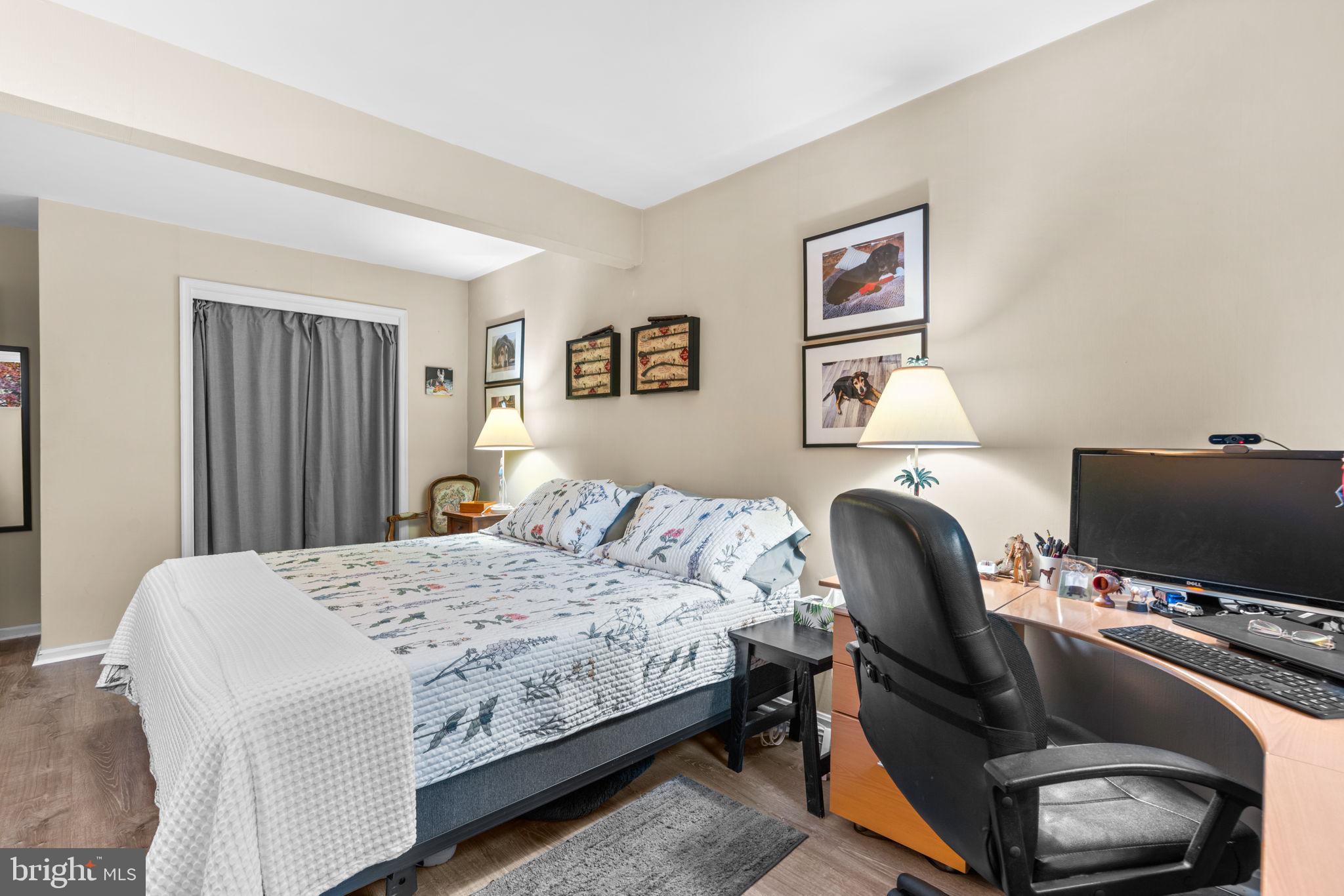 9413 Sunfall Court Columbia, MD 21046 - Photo 54 of 71 a bedroom with a bed and a flat screen tv