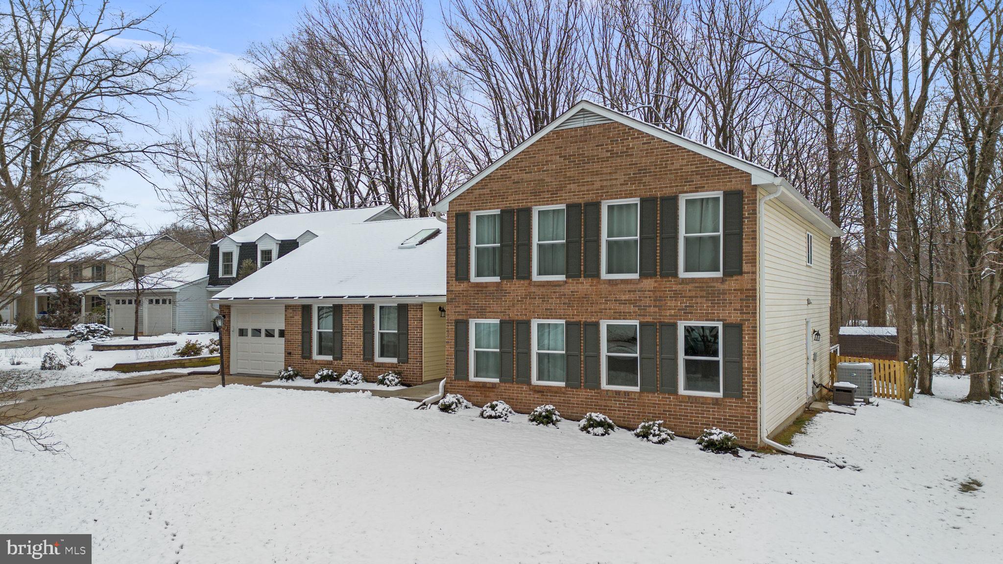 9413 Sunfall Court Columbia, MD 21046 - Photo 59 of 71 a front view of a house with a yard