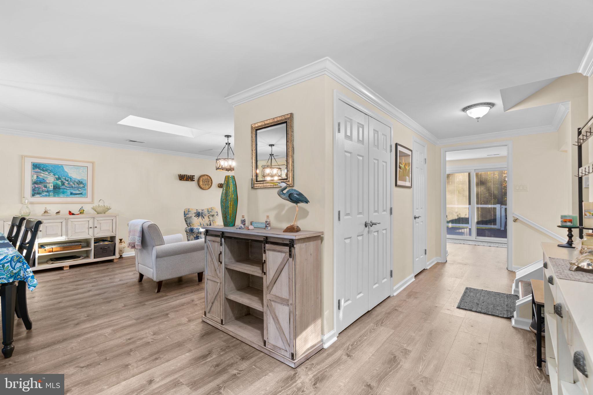 9413 Sunfall Court Columbia, MD 21046 - Photo 6 of 71 a living room with furniture and a wooden floor