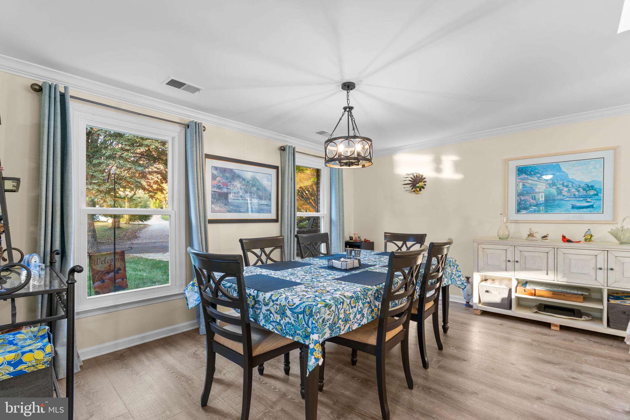 9413 Sunfall Court Columbia, MD 21046 - Photo 7 of 71 a view of a dining room with furniture window and wooden floor