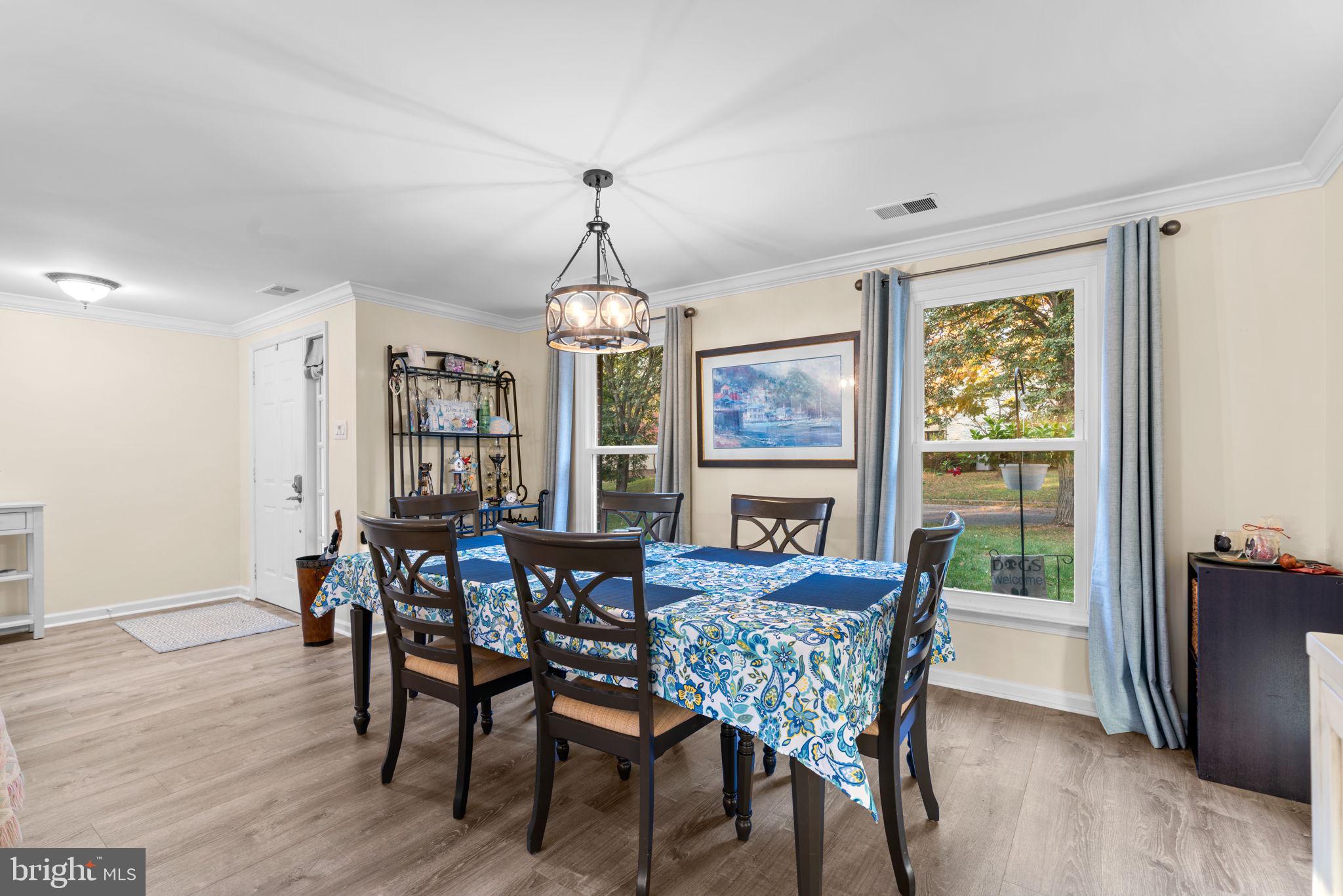 9413 Sunfall Court Columbia, MD 21046 - Photo 8 of 71 a view of a dining room with furniture window and wooden floor