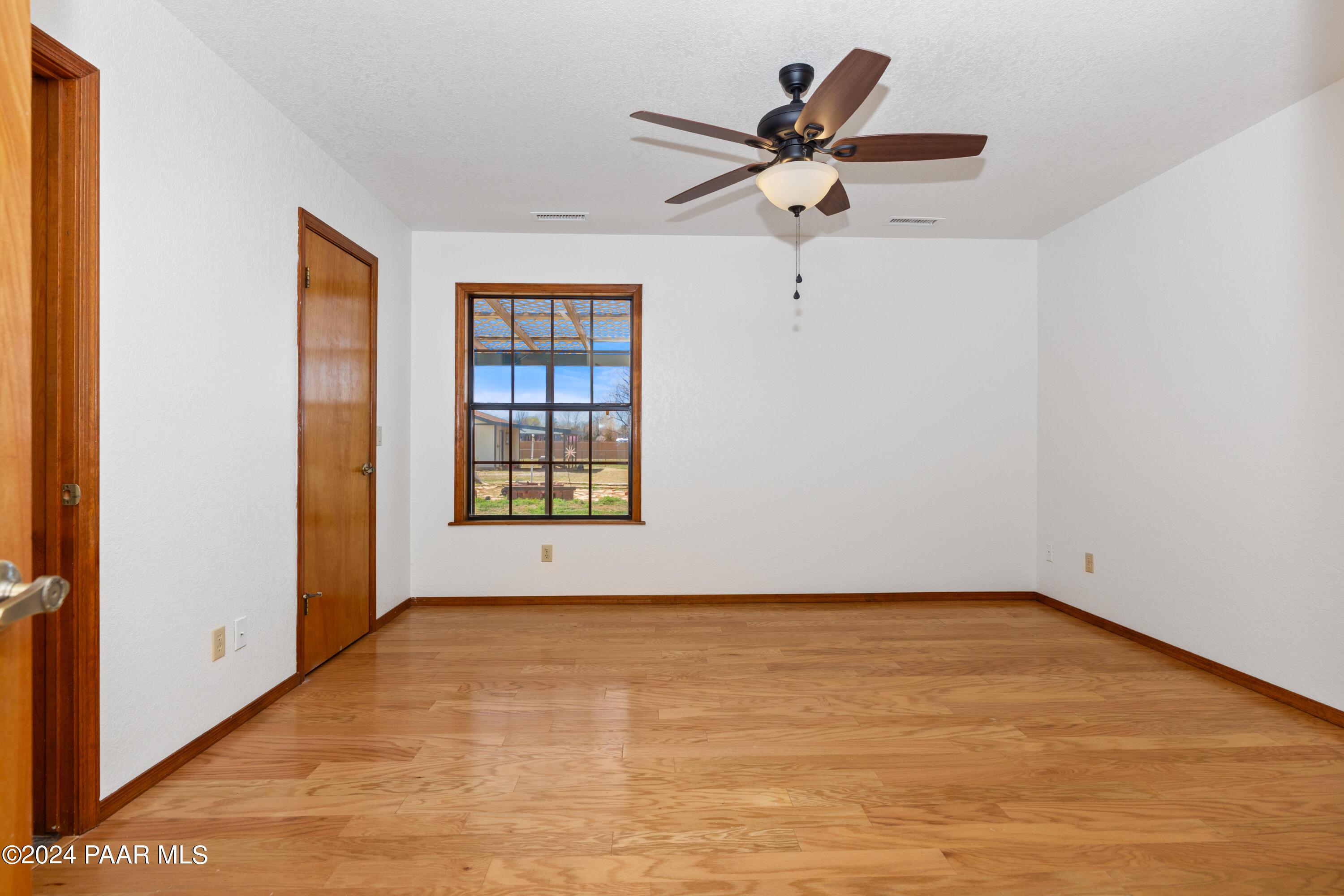 2170 Val Vista Drive Chino Valley, AZ 86323 - Photo 11 of 33 wooden floor in a room with a window