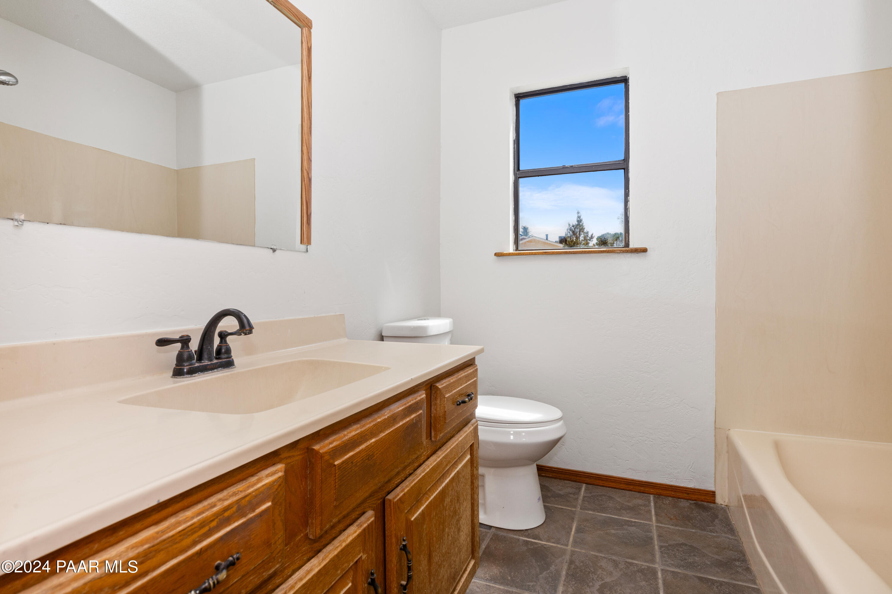 2170 Val Vista Drive Chino Valley, AZ 86323 - Photo 13 of 33 a bathroom with a sink a toilet and shower