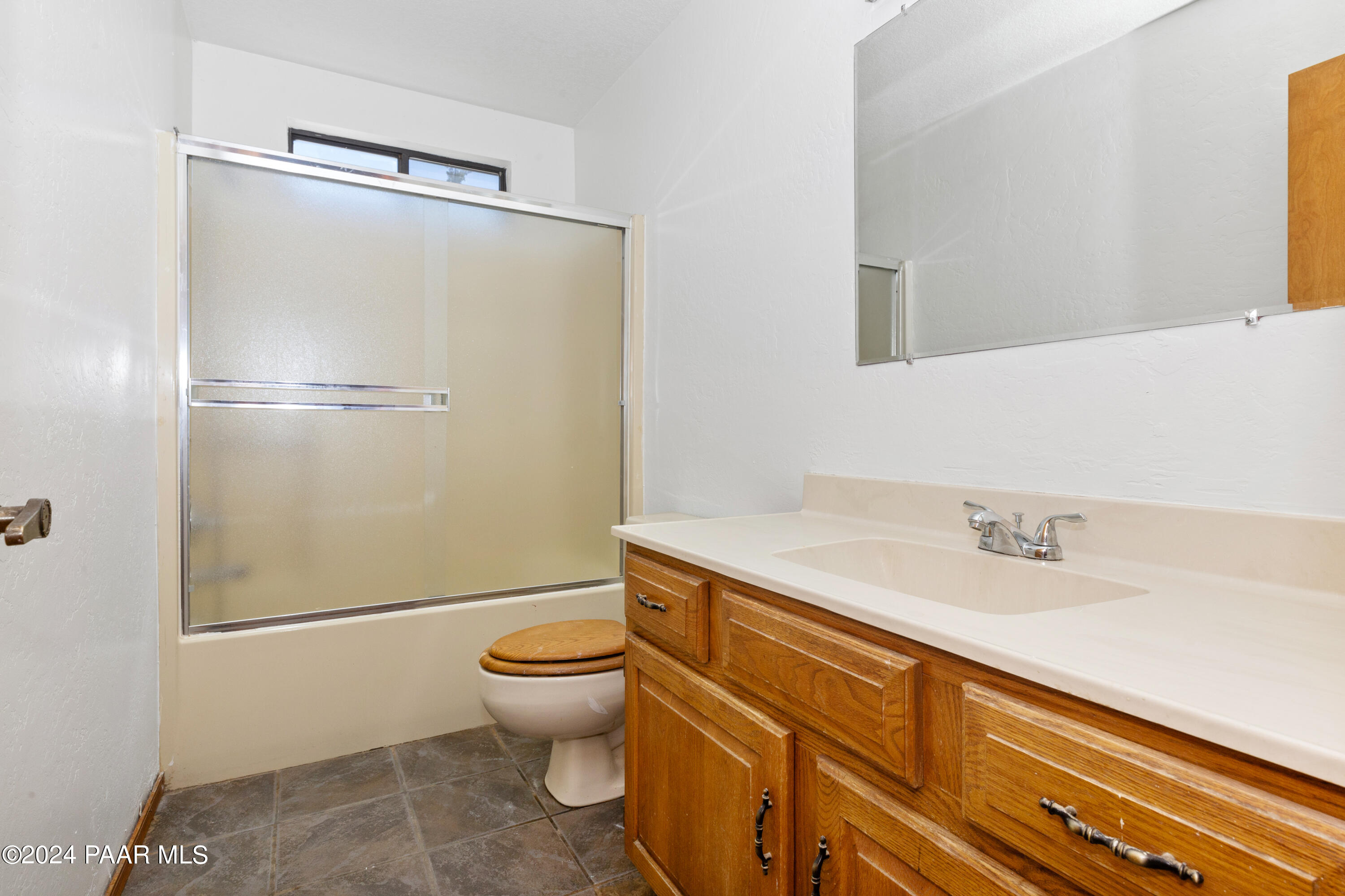 2170 Val Vista Drive Chino Valley, AZ 86323 - Photo 15 of 33 a bathroom with a granite countertop sink toilet and shower