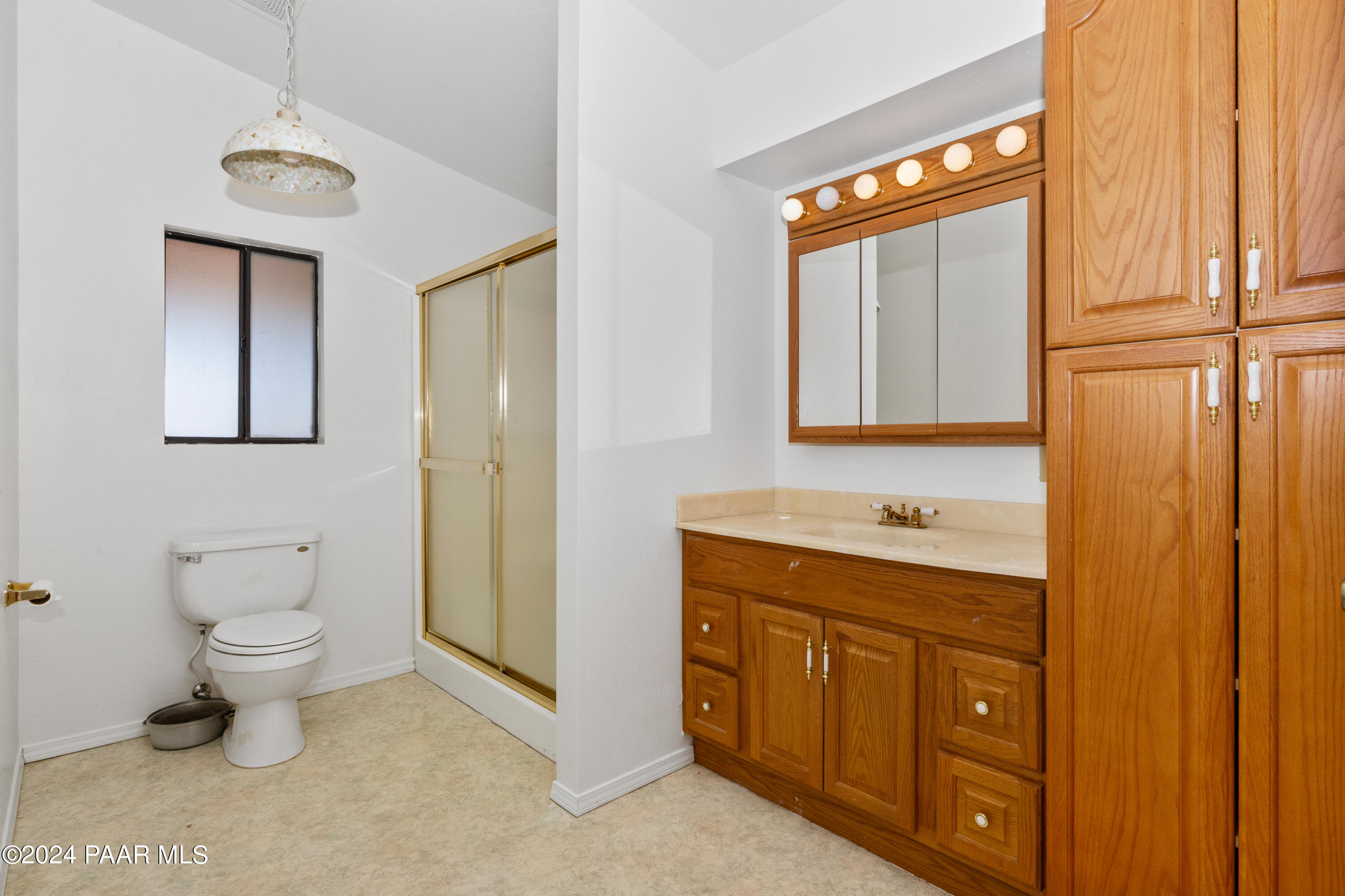 2170 Val Vista Drive Chino Valley, AZ 86323 - Photo 25 of 33 a bathroom with a toilet sink a mirror and vanity