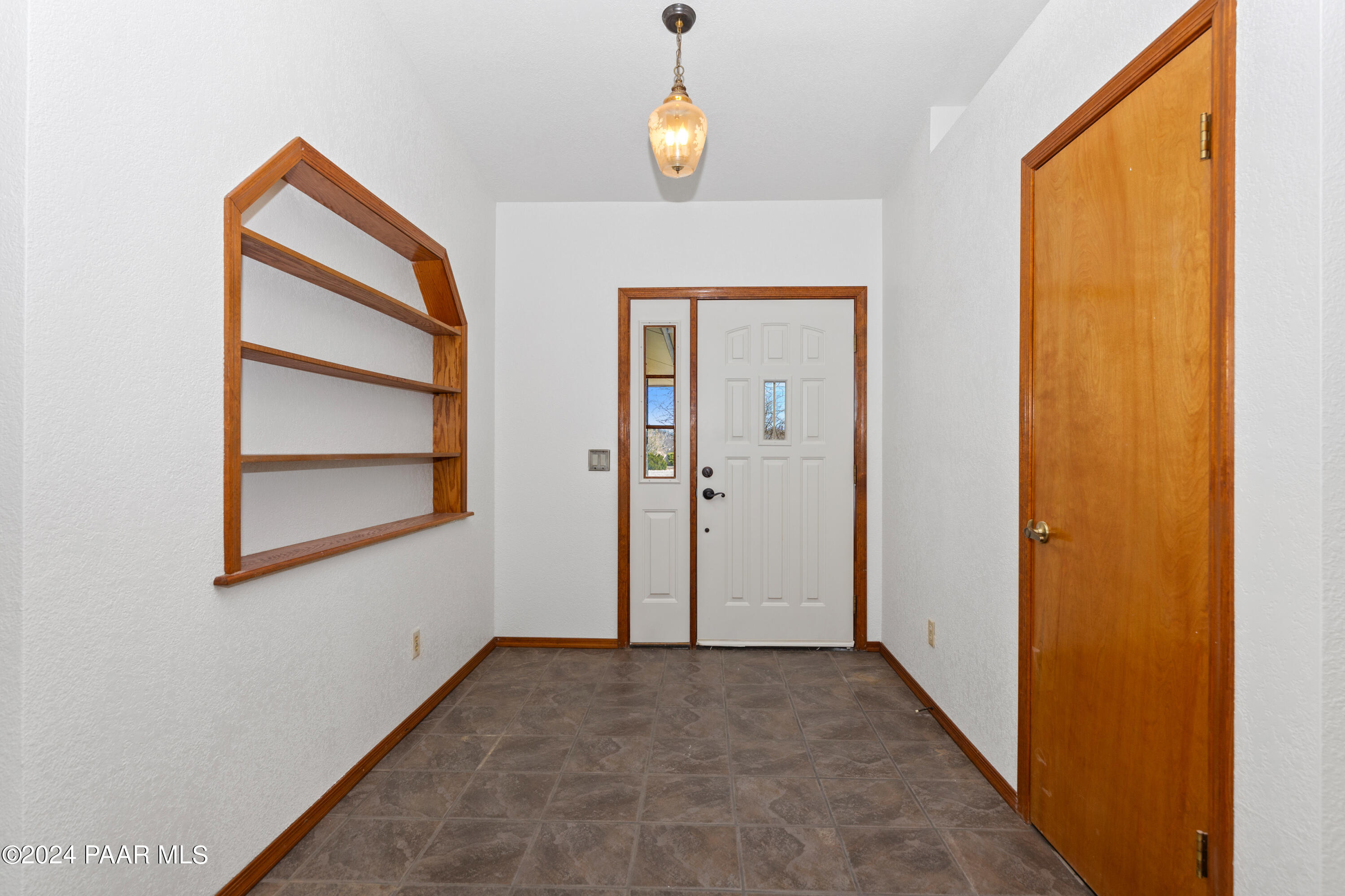 2170 Val Vista Drive Chino Valley, AZ 86323 - Photo 4 of 33 an empty room that has a window and painted walls