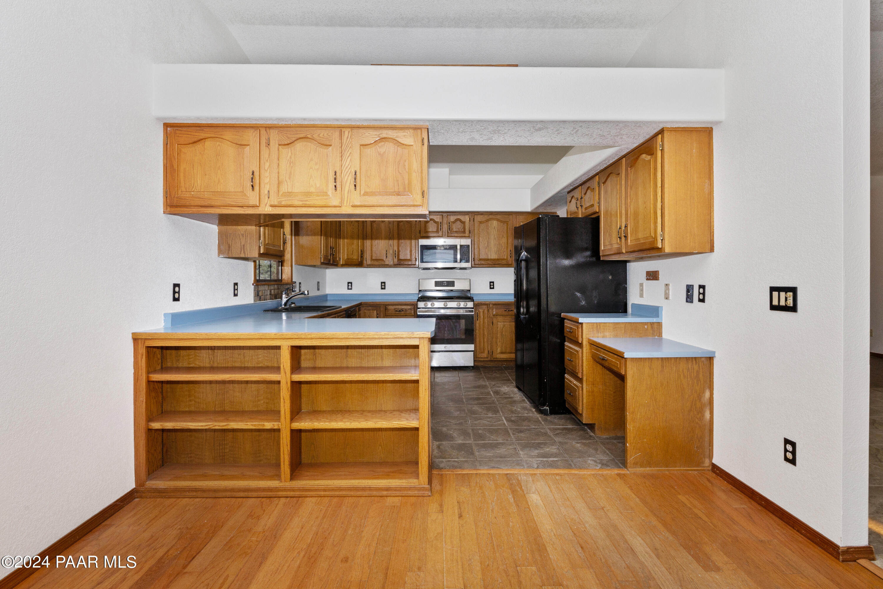 2170 Val Vista Drive Chino Valley, AZ 86323 - Photo 7 of 33 a kitchen with stainless steel appliances a stove and more cabinets