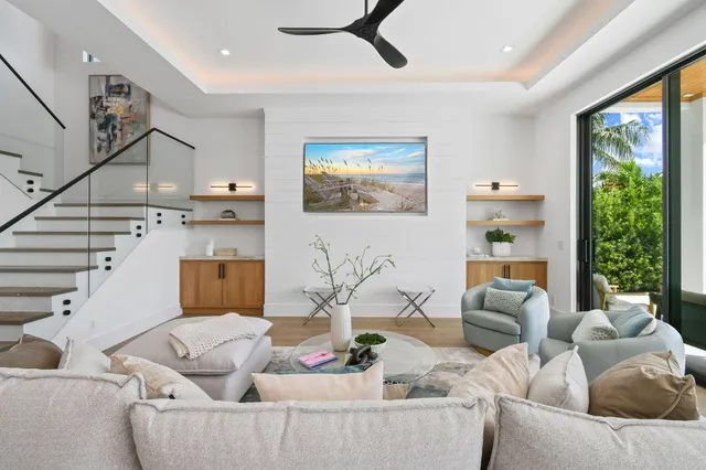 a dining room with furniture a chandelier and window