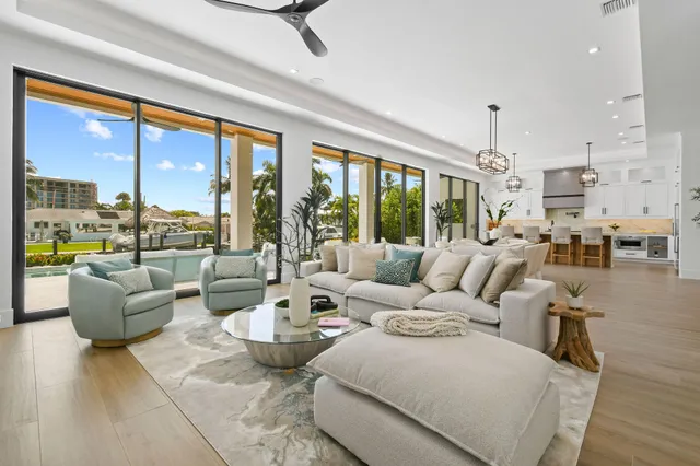 a kitchen with a dining table cabinets and appliances