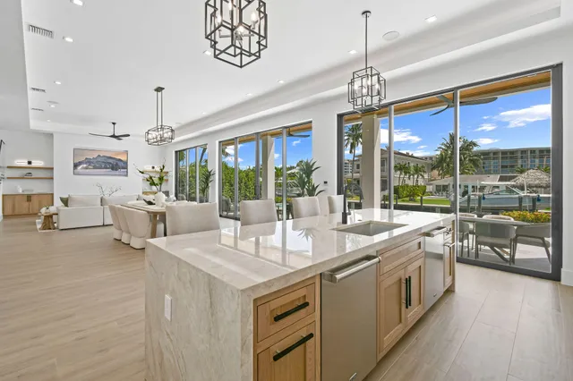 a bathroom with a shower sink vanity and toilet