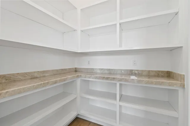 a view of a kitchen with sink and washing machine
