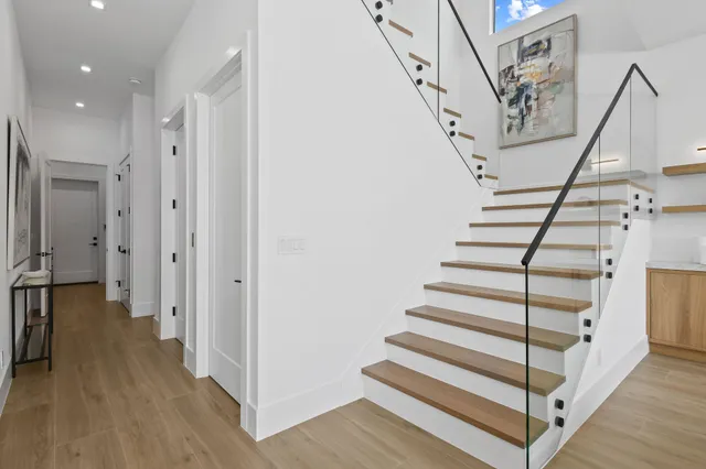 a living room with furniture potted plant and a window