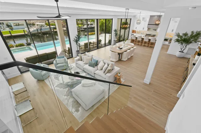 a bedroom with a large bed and a large window with outer view