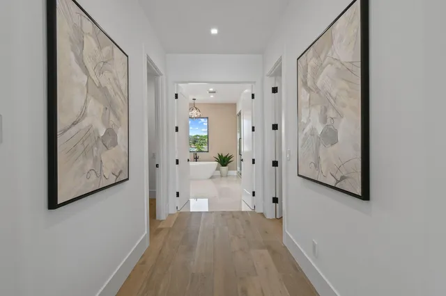 a bathroom with a granite countertop sink a toilet a mirror and shower