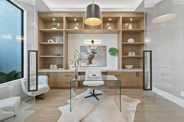 a living room with furniture and a potted plant