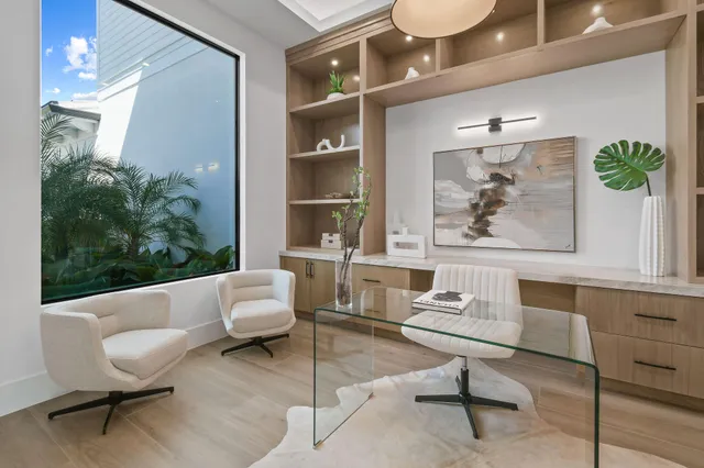 a living room with furniture and a potted plant