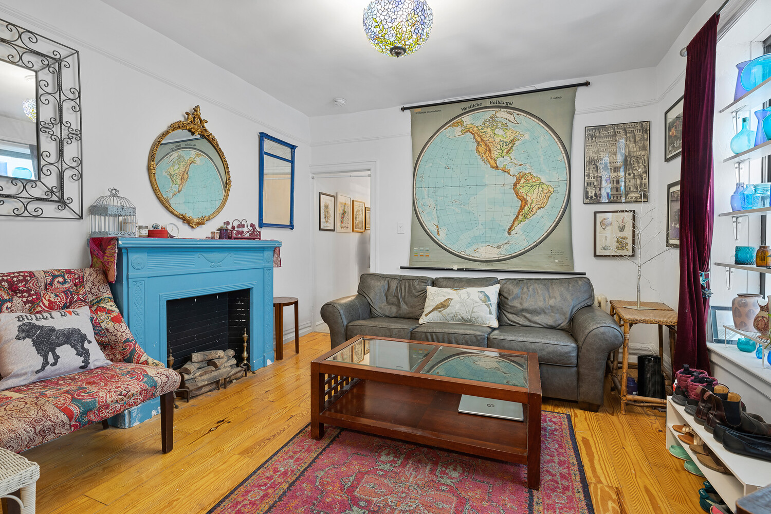 214 Bradhurst Avenue, Unit 4 Manhattan, NY 10039 - Photo 1 of 11 a living room with furniture a clock and a fireplace