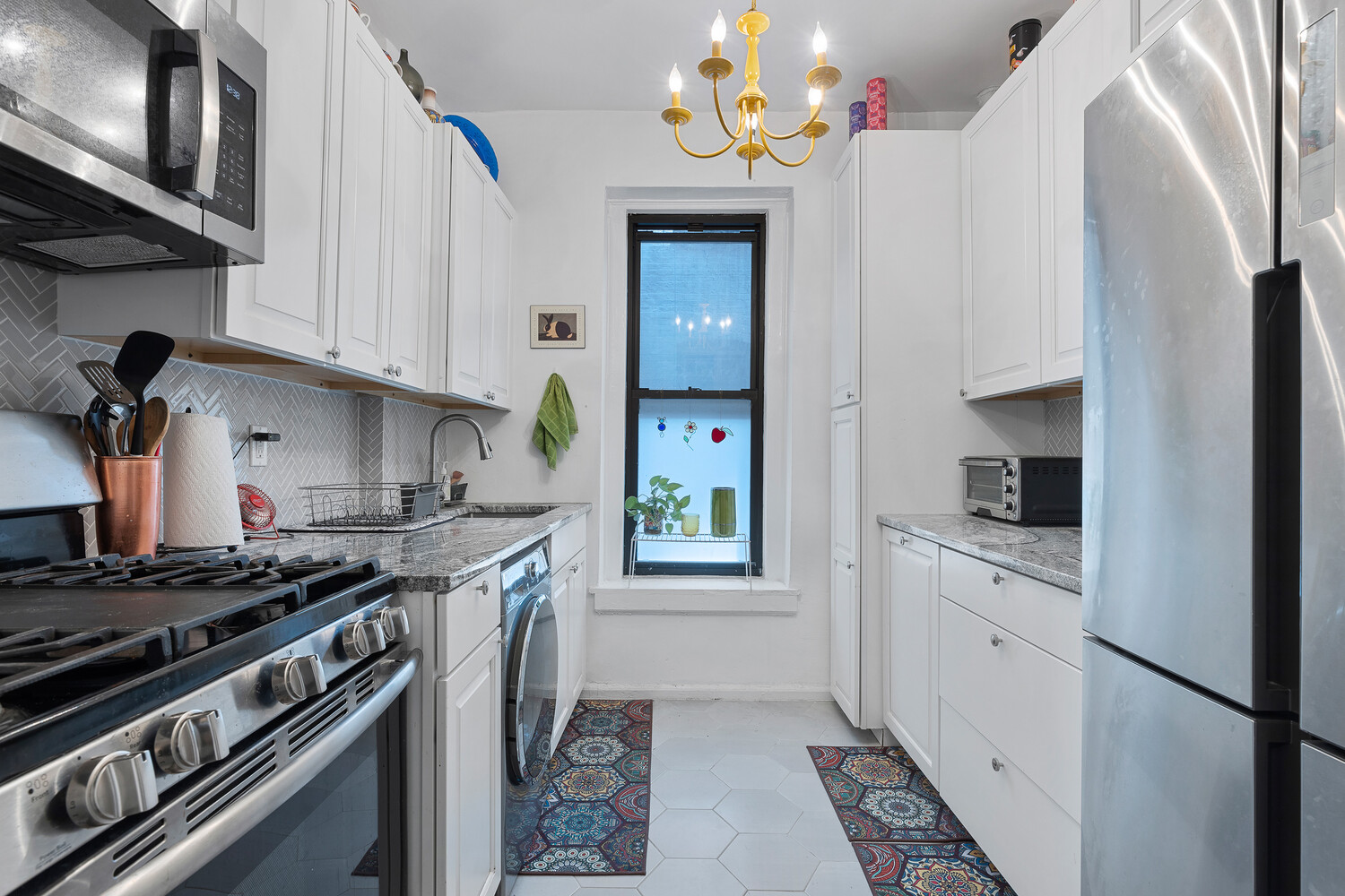214 Bradhurst Avenue, Unit 4 Manhattan, NY 10039 - Photo 5 of 11 a kitchen with a stove and a refrigerator