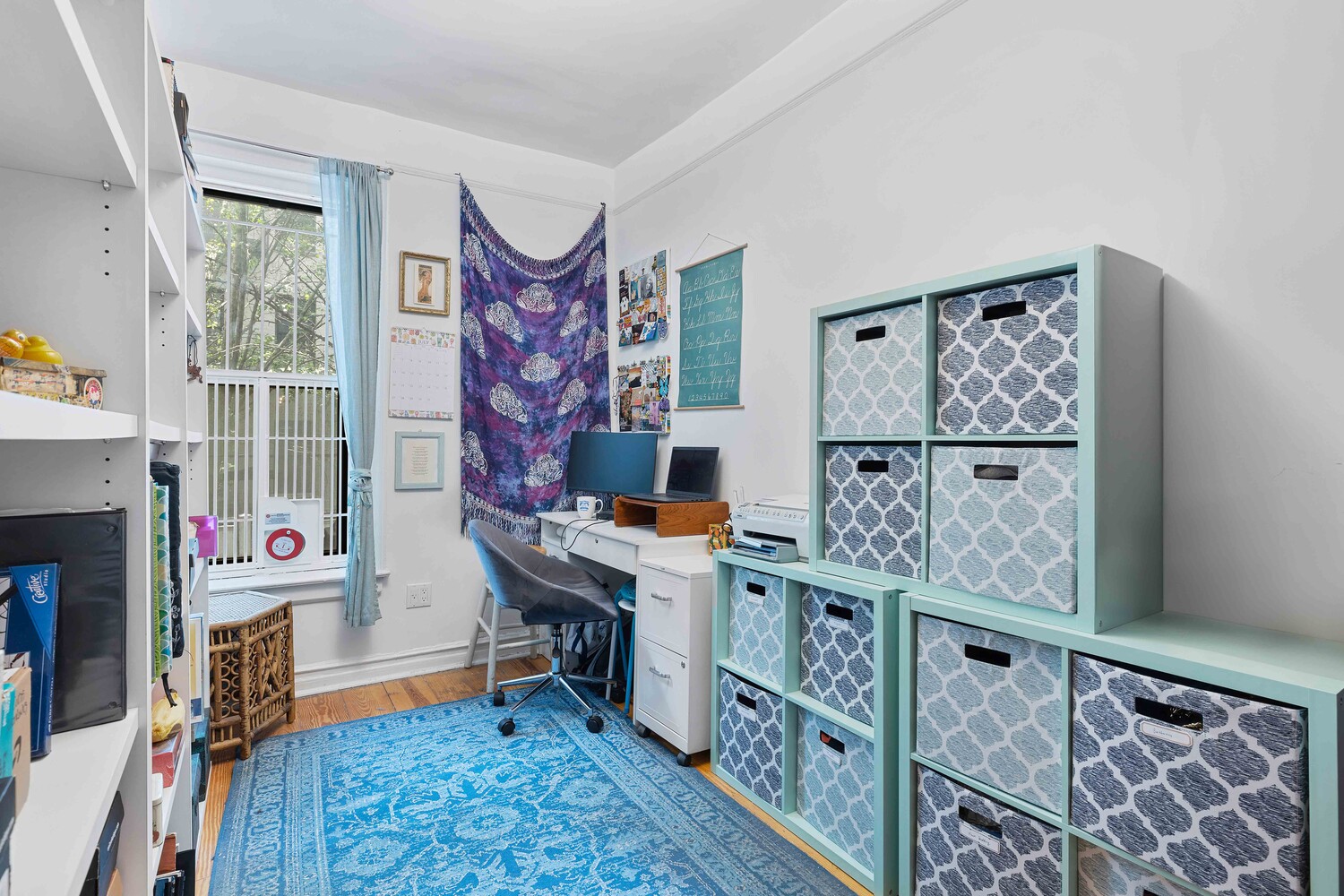 214 Bradhurst Avenue, Unit 4 Manhattan, NY 10039 - Photo 8 of 11 a view of a workspace with furniture and toys