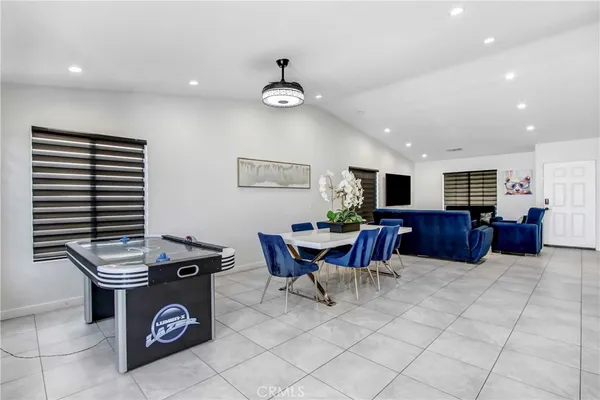 a kitchen with a table and chairs