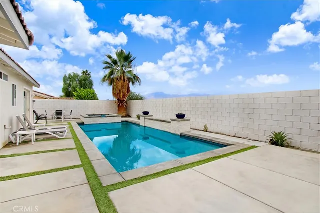 a view of a pool with a yard