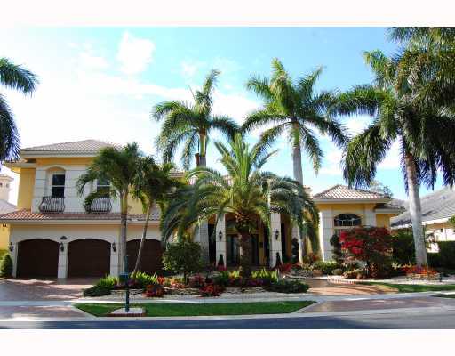 a front view of multiple houses with yard