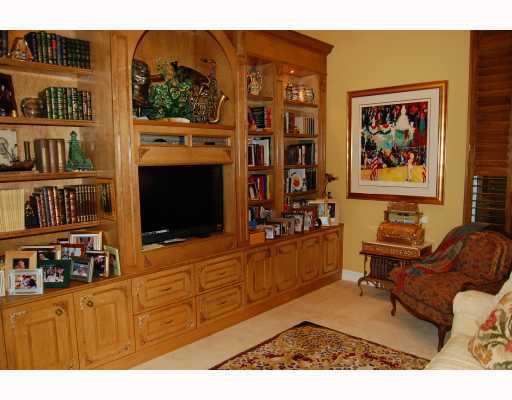 3796 Northwest Coventry Lane Boca Raton, FL 33496 - Photo 13 of 16 a living room with furniture cabinets and a flat screen tv