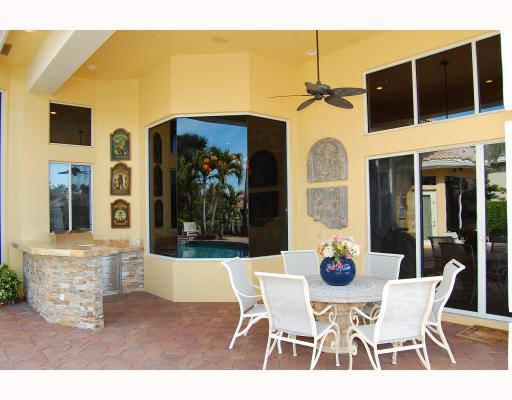 3796 Northwest Coventry Lane Boca Raton, FL 33496 - Photo 15 of 16 a view of a dining room with furniture and chandelier