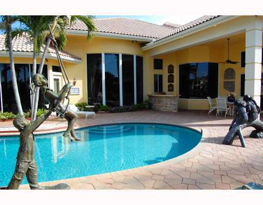 3796 Northwest Coventry Lane Boca Raton, FL 33496 - Photo 16 of 16 a swimming pool with outdoor seating