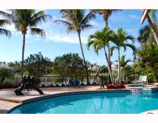 3796 Northwest Coventry Lane Boca Raton, FL 33496 - Photo 3 of 16 a view of a swimming pool with a garden