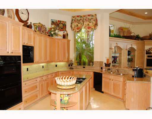 3796 Northwest Coventry Lane Boca Raton, FL 33496 - Photo 5 of 16 a bathroom with a sink a mirror and a bathtub