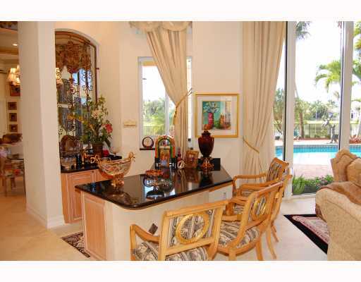 3796 Northwest Coventry Lane Boca Raton, FL 33496 - Photo 6 of 16 a view of a dining room with furniture window and wooden floor