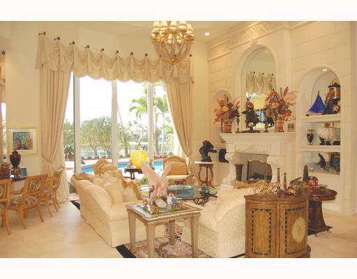 3796 Northwest Coventry Lane Boca Raton, FL 33496 - Photo 8 of 16 a living room with couches and a dining table with garden view