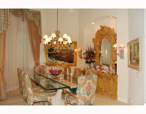 3796 Northwest Coventry Lane Boca Raton, FL 33496 - Photo 9 of 16 a dining room with furniture and chandelier