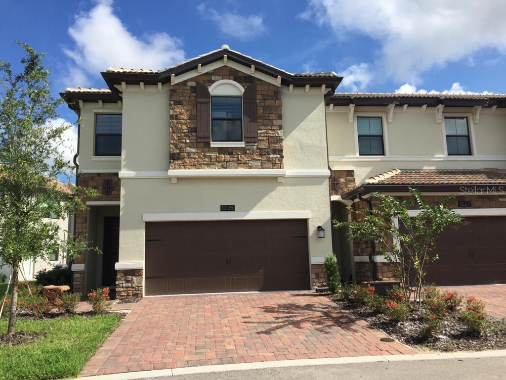 1225 Sandwedge Street Davenport, FL 33896 - Photo 1 of 1 a front view of a house with a yard
