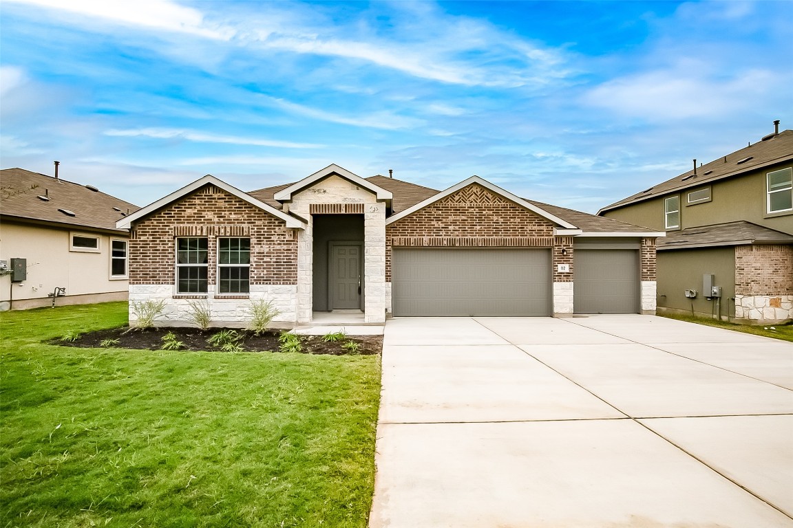 112 Juniper Springs Road Kyle, TX 78640 - Photo 1 of 1 a front view of a house with a yard