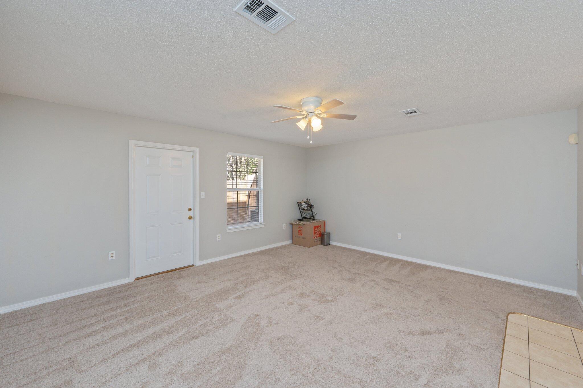 472 Keystone Road Mary Esther, FL 32569 - Photo 3 of 12 a view of an empty room with a window