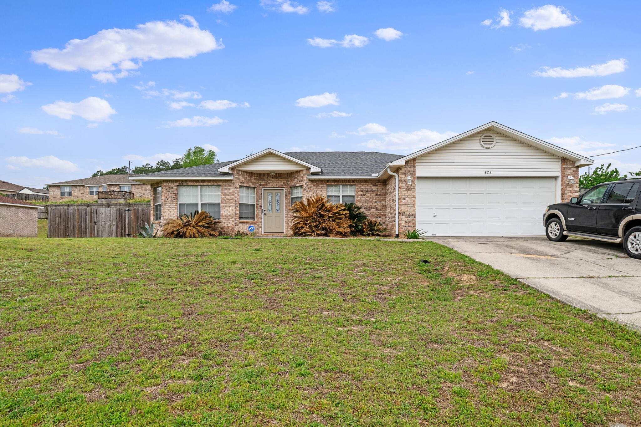 472 Keystone Road Mary Esther, FL 32569 - Photo 8 of 12 a front view of a house with a garden