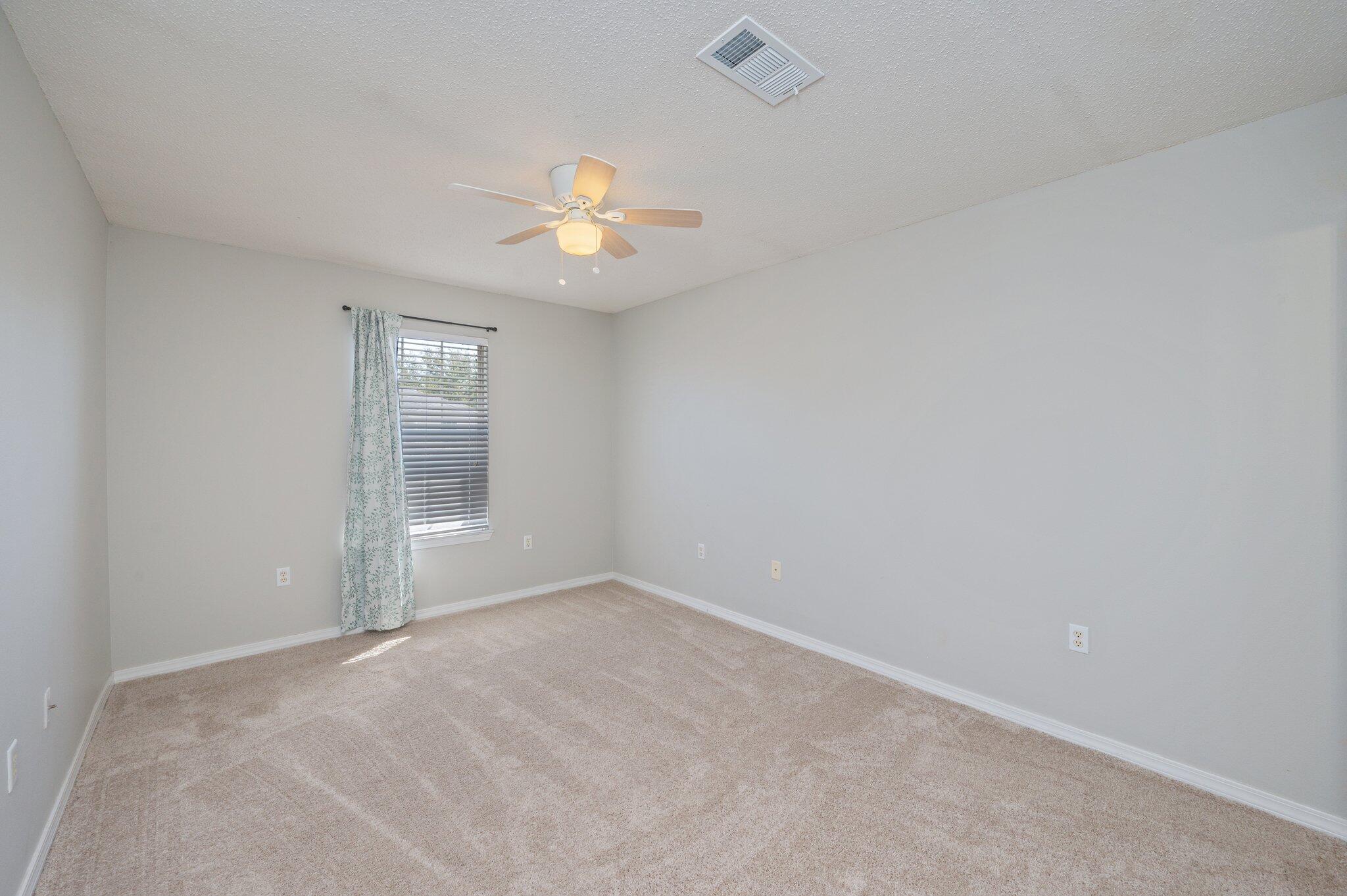 472 Keystone Road Mary Esther, FL 32569 - Photo 9 of 12 an empty room with a window