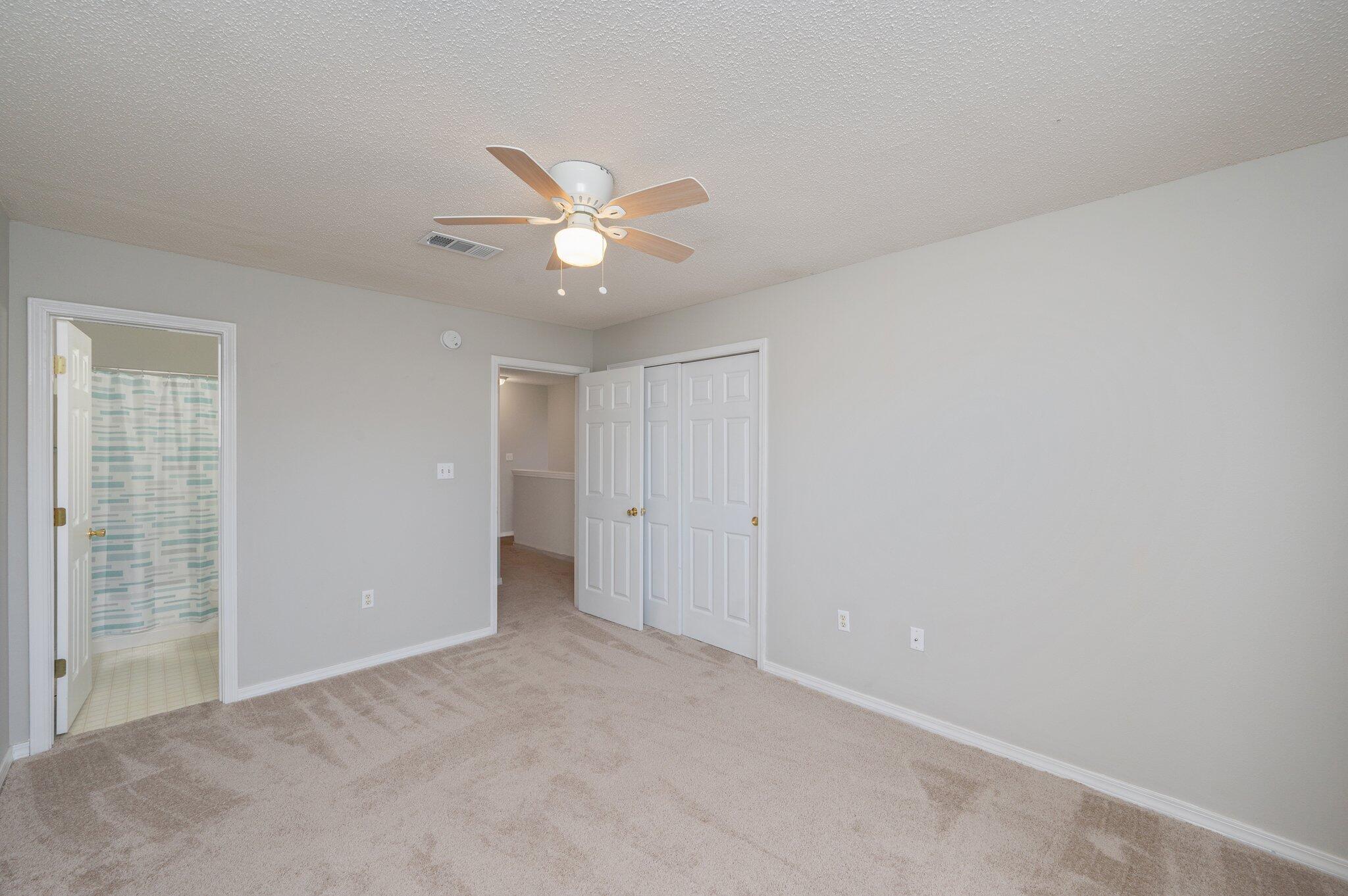 472 Keystone Road Mary Esther, FL 32569 - Photo 10 of 12 an empty room with a ceiling fan and a window