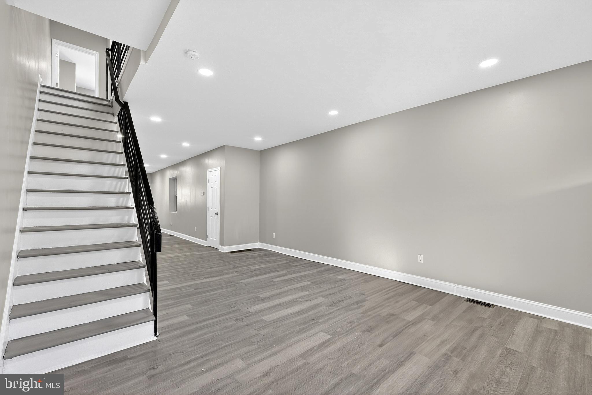 5443 Irving Street Philadelphia, PA 19139 - Photo 11 of 50 a view of a room with wooden floor and stairs