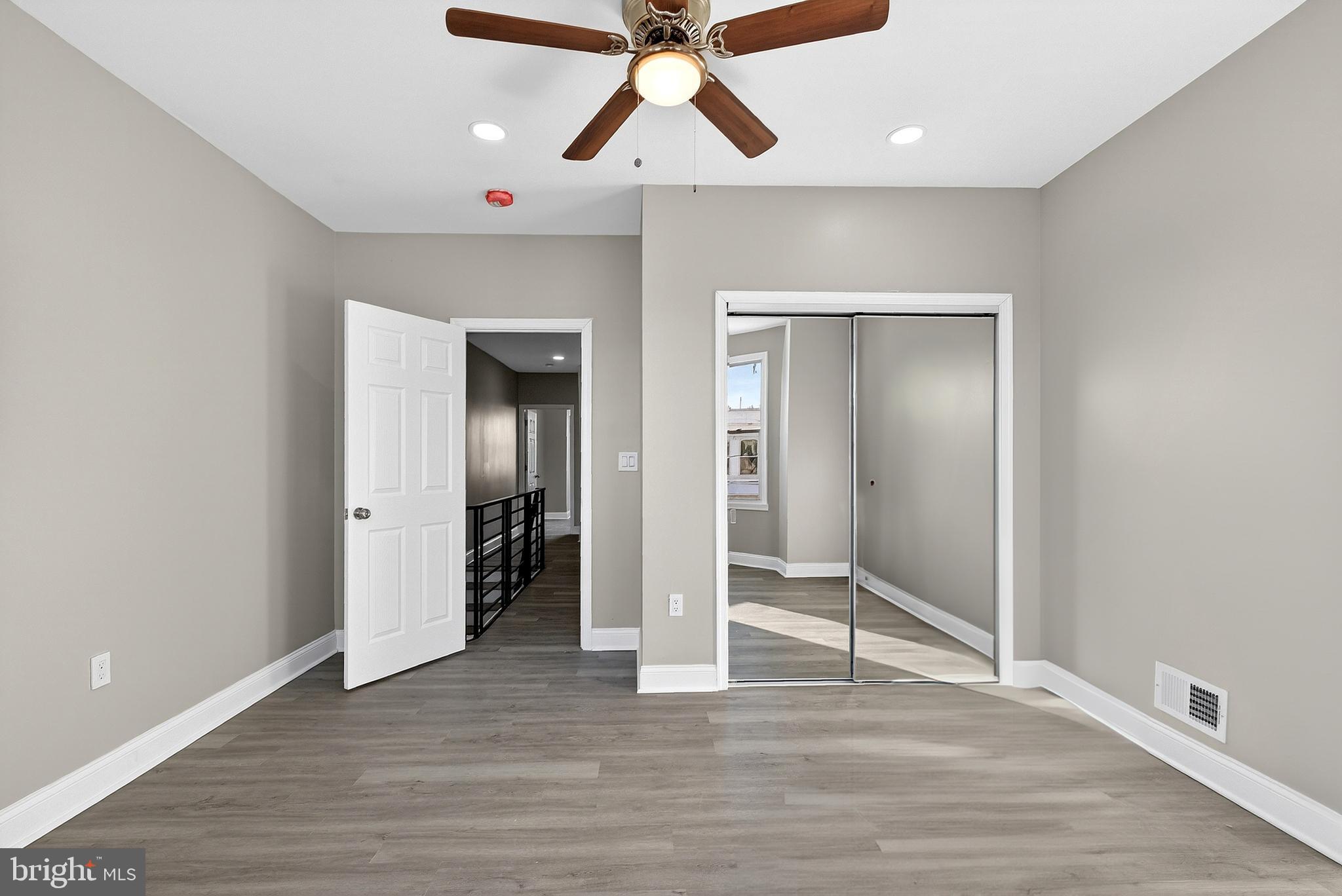 5443 Irving Street Philadelphia, PA 19139 - Photo 21 of 50 an empty room with wooden floor and ceiling fan