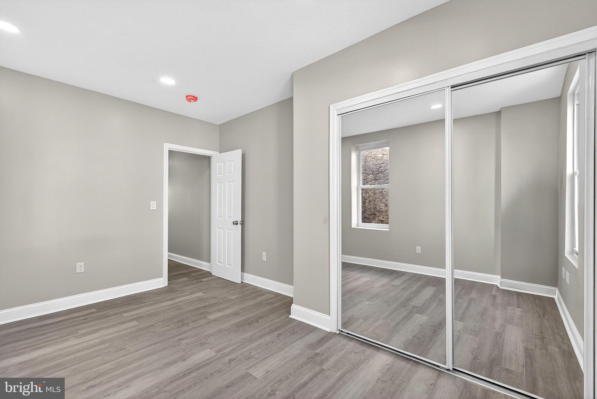 5443 Irving Street Philadelphia, PA 19139 - Photo 24 of 50 an empty room with wooden floor and closet
