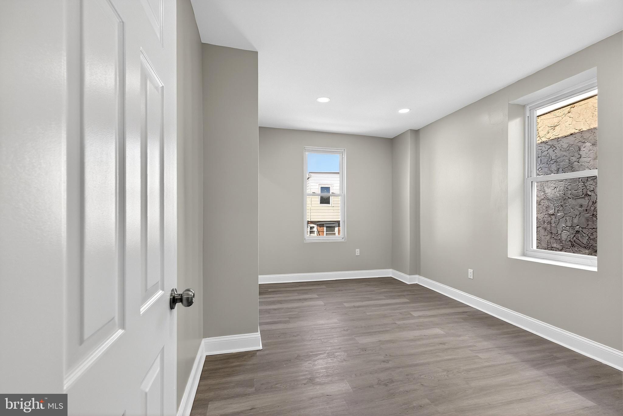 5443 Irving Street Philadelphia, PA 19139 - Photo 29 of 50 an empty room with wooden floor and windows