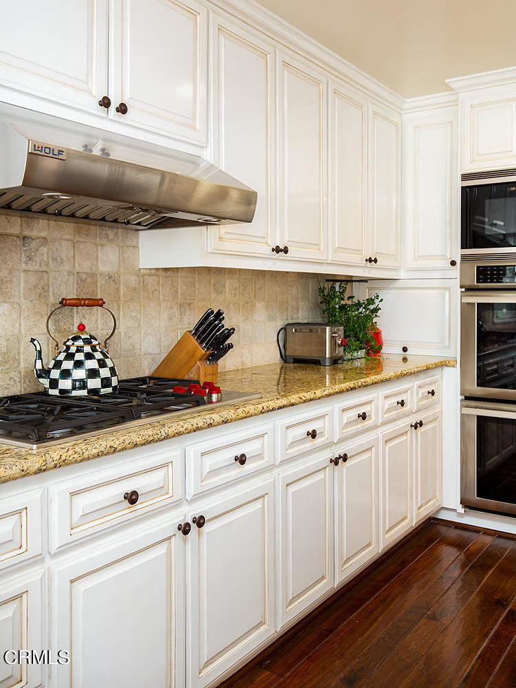 4535 Lone Pine Lane La Canada Flintridge, CA 91011 - Photo 18 of 62 a kitchen with white cabinets and sink