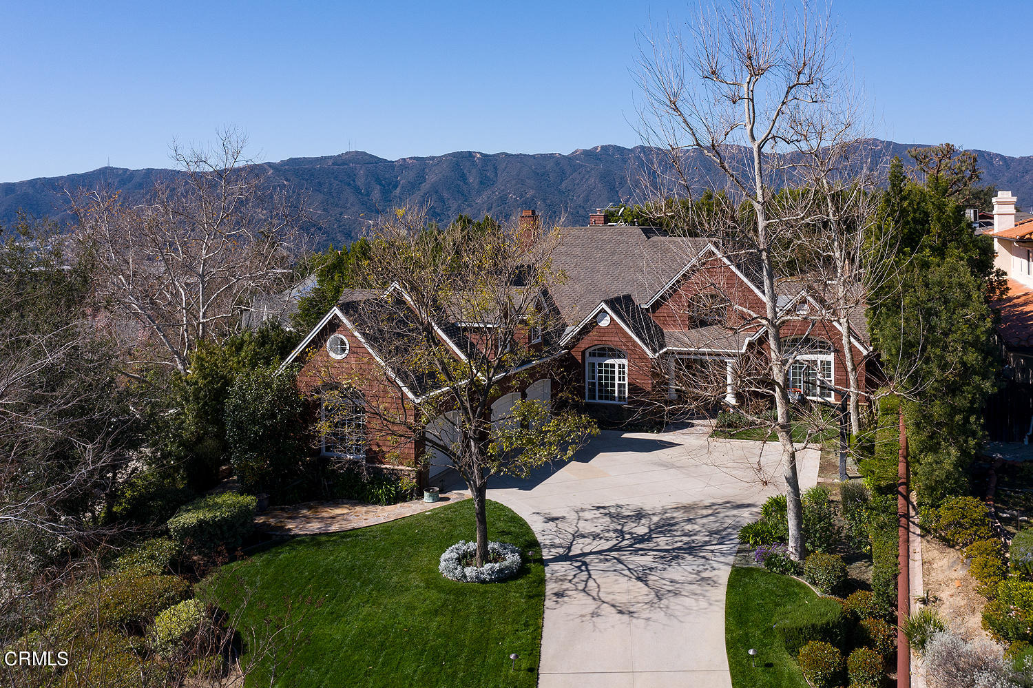 4535 Lone Pine Lane La Canada Flintridge, CA 91011 - Photo 5 of 62 a front view of a house with a yard
