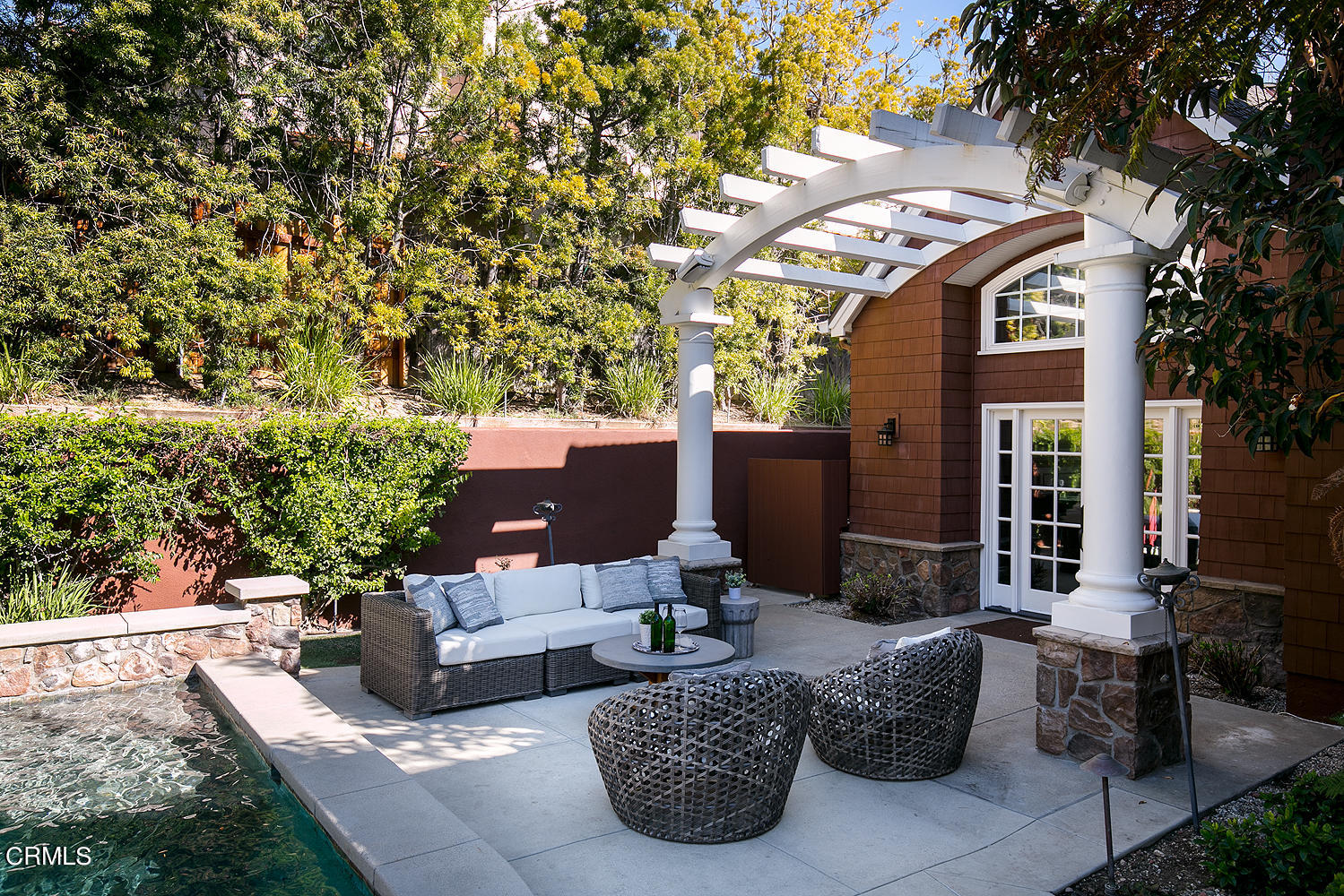 4535 Lone Pine Lane La Canada Flintridge, CA 91011 - Photo 52 of 62 a view of a patio with couches table and chairs and potted plants